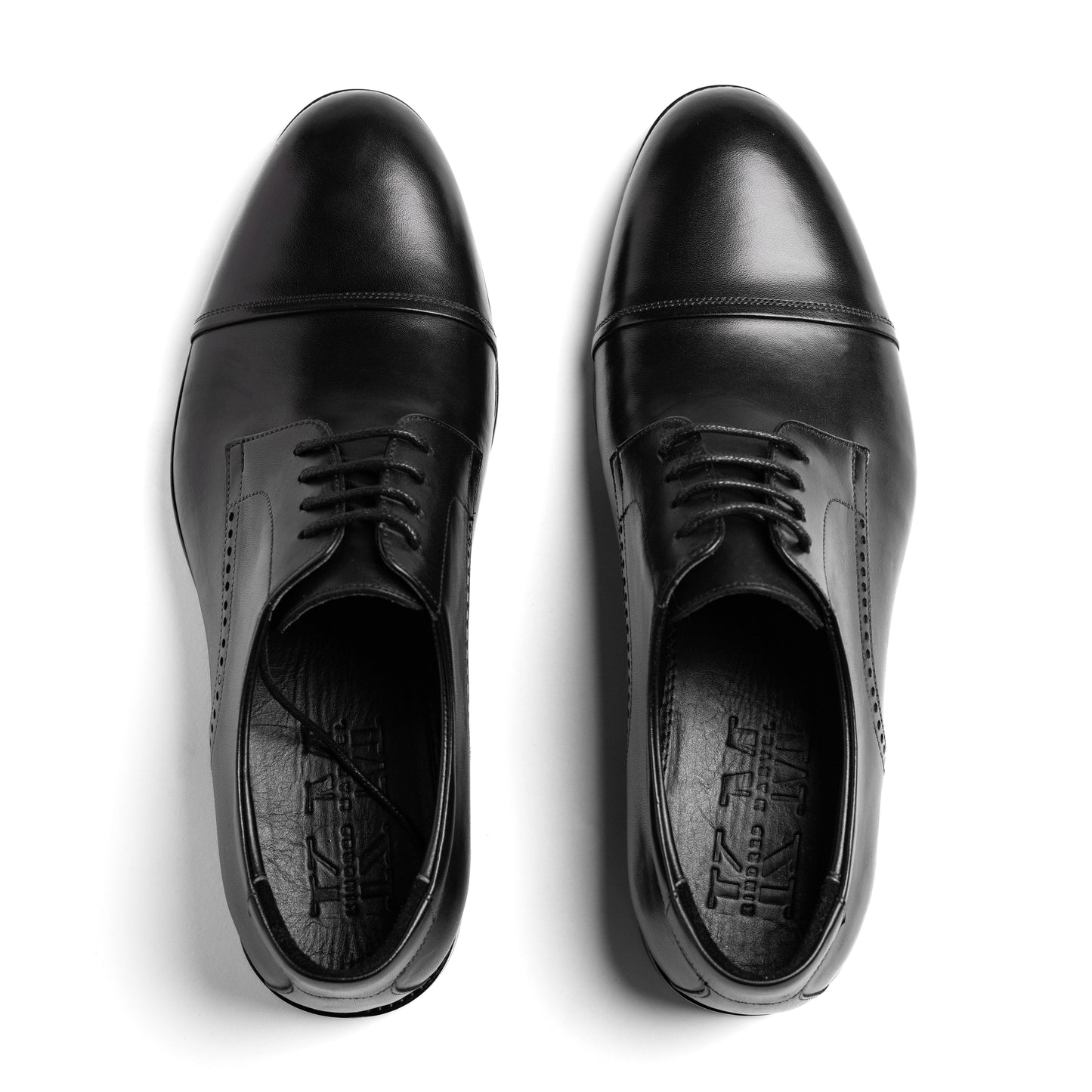 Top-down view of the Cap Toe Derby Black, revealing precise cap toe detail and refined lace construction