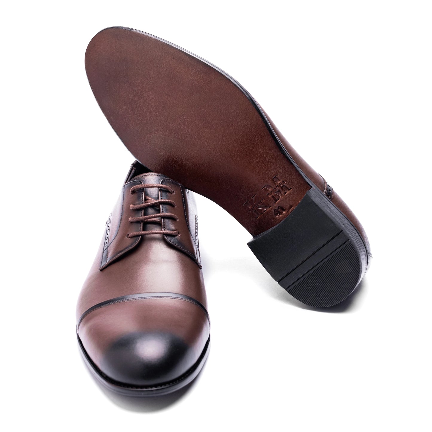 Underside view of the Cap Toe Derby Brown featuring durable rubber sole with anti-slip texture