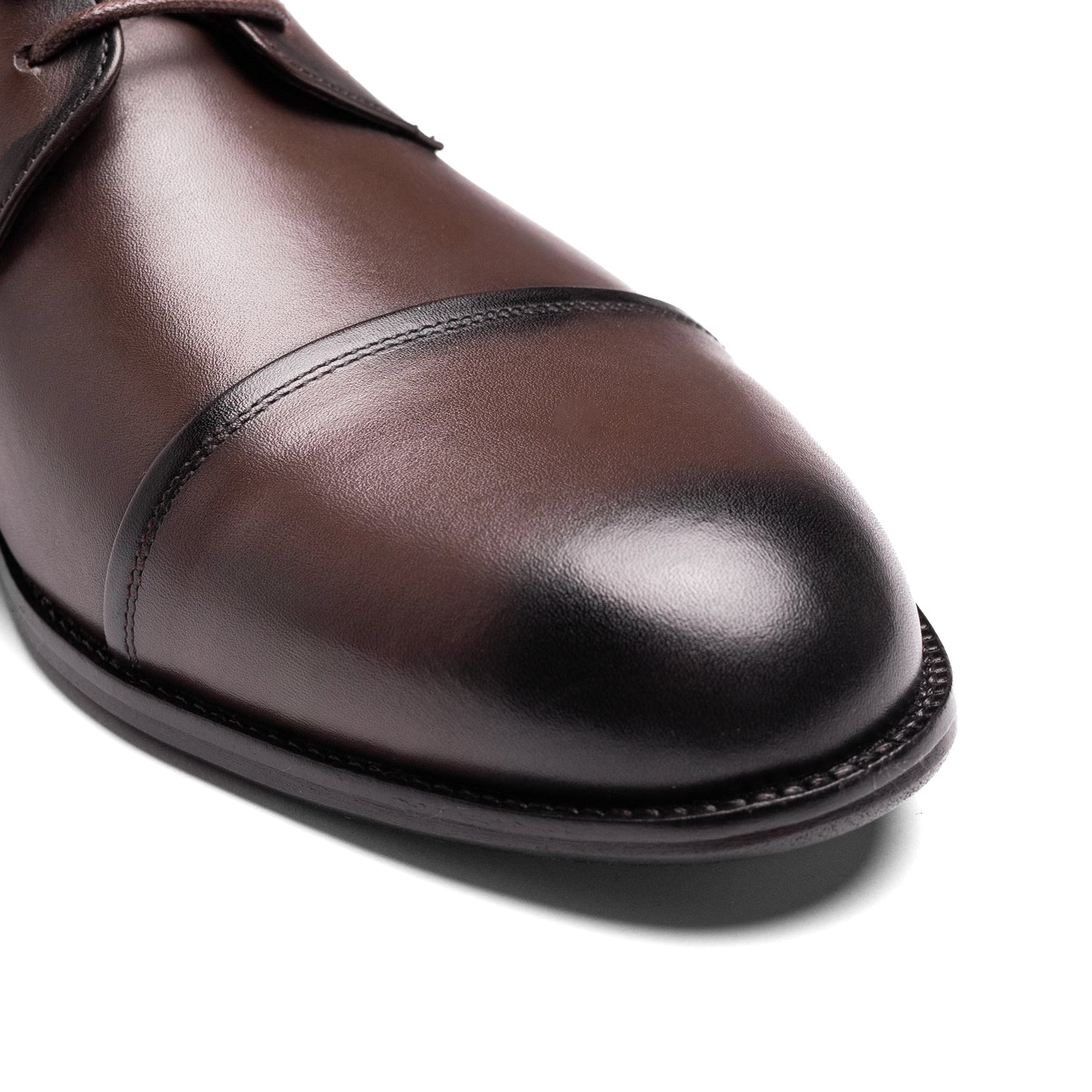 Three-quarter angle of the Cap Toe Derby Brown highlighting its refined silhouette and cap toe detail