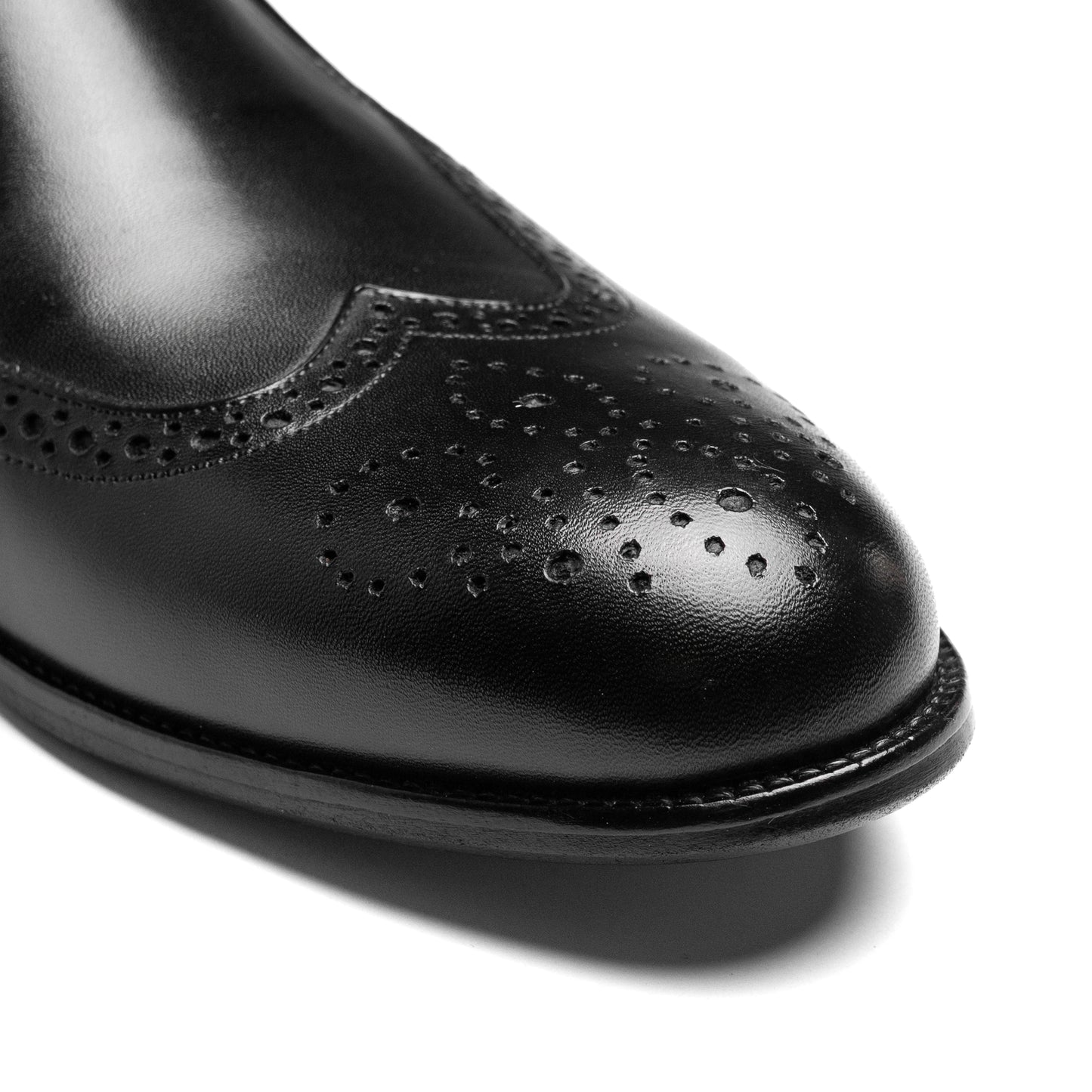 Craft Loafer Brogue Wingtip Black styled with tailored suit in Dubai setting