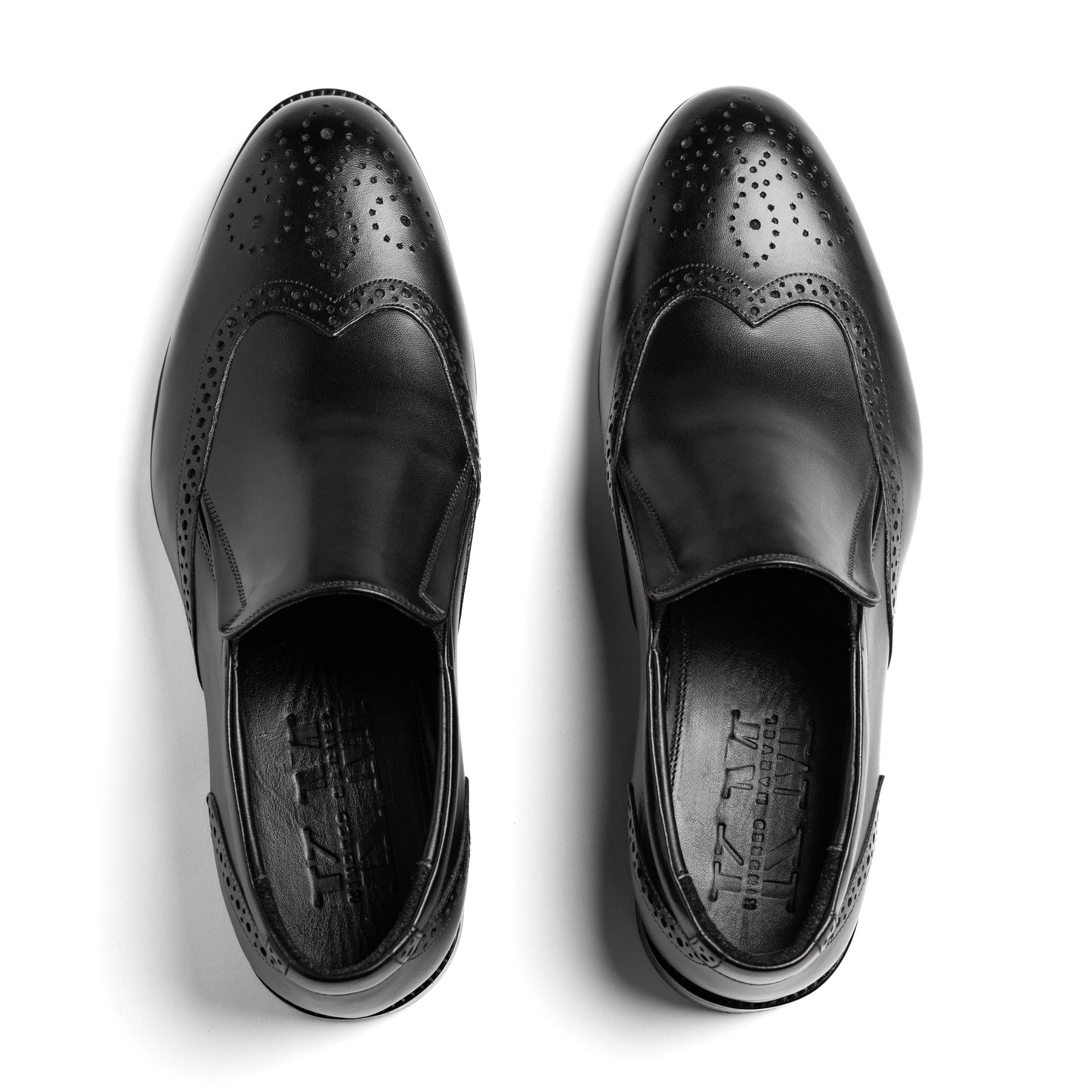 Overhead view of Craft Loafer Brogue Wingtip Black highlighting brogue perforations