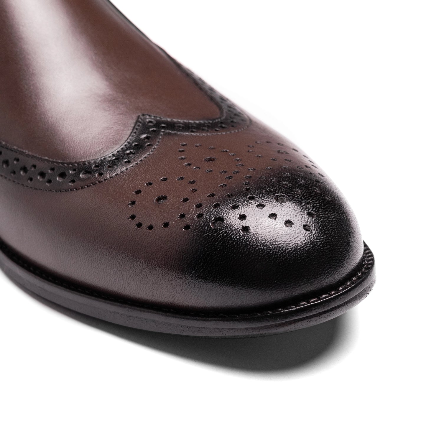 Craft Loafer Brogue Wingtip Brown styled with tailored trousers in urban setting