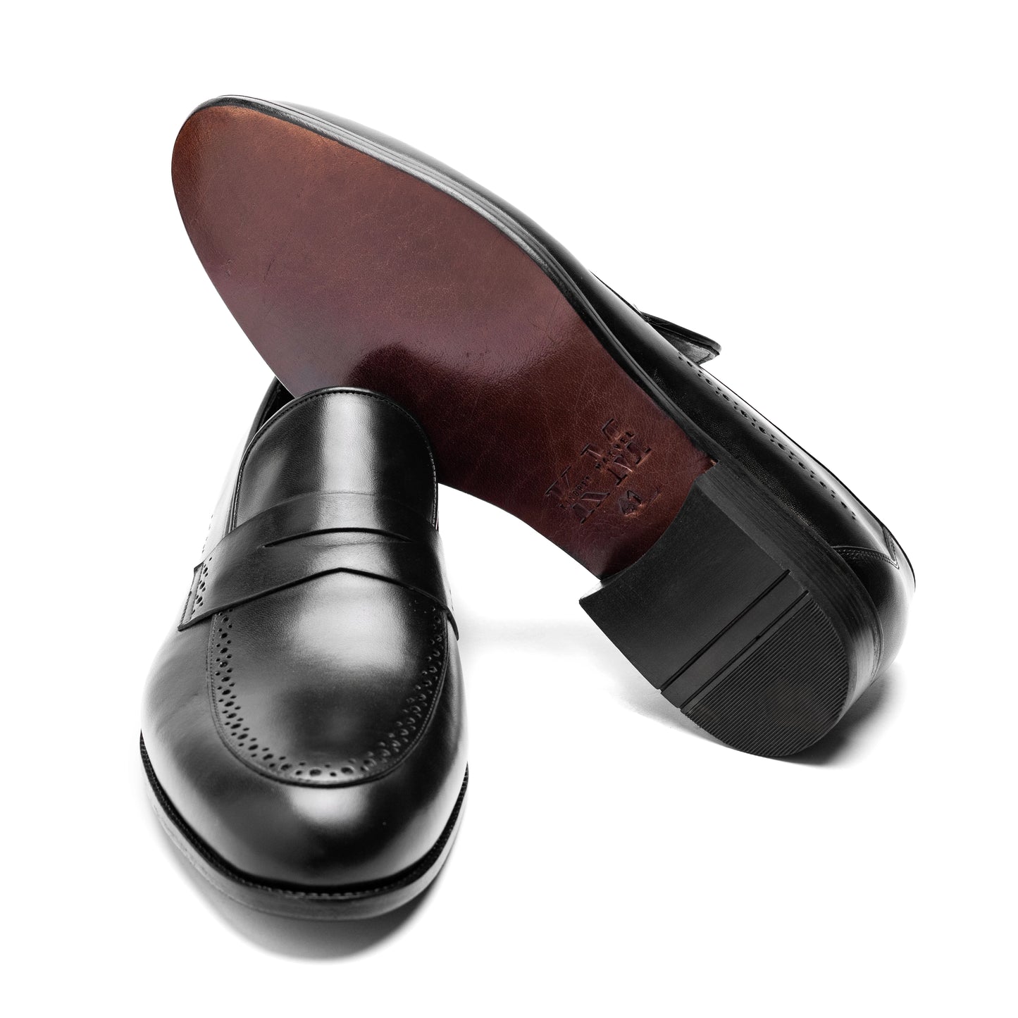 Un Aldric Step Black penny loafer styled with formal trousers