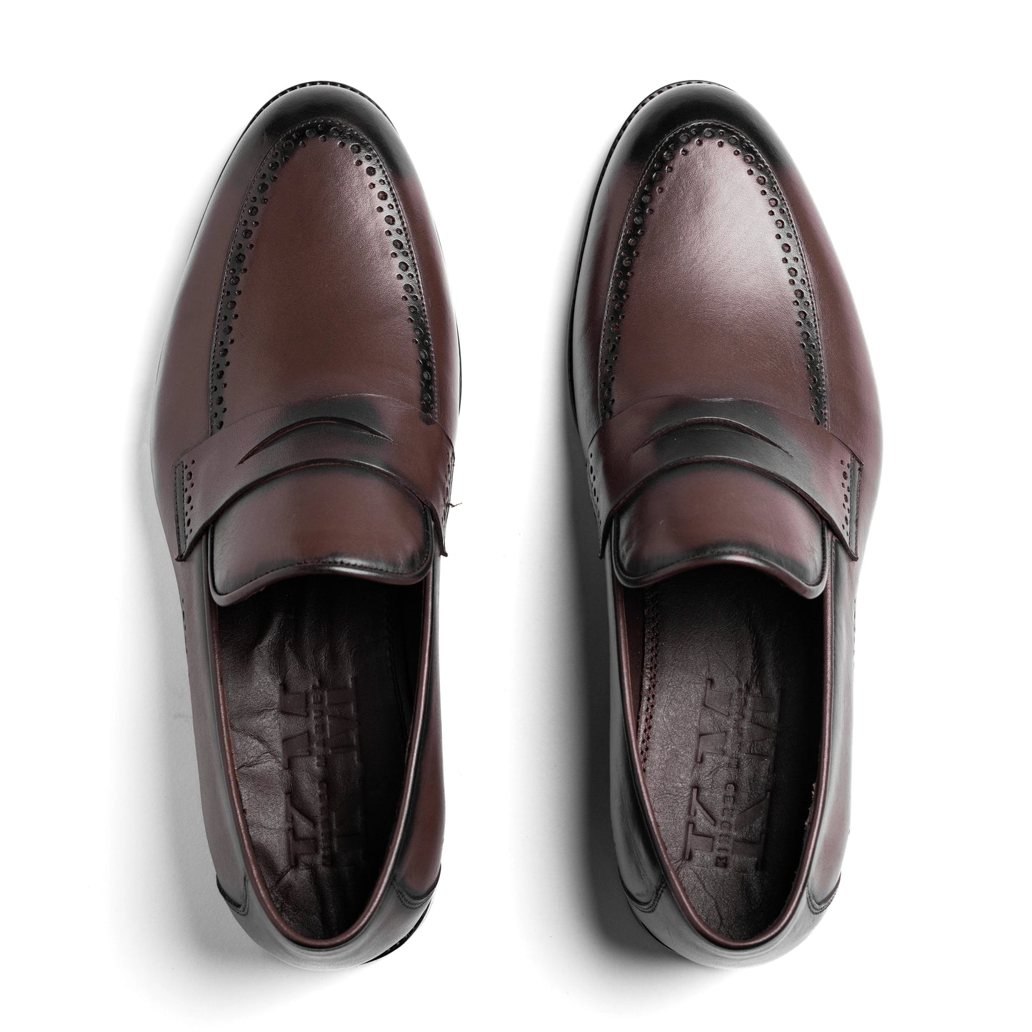 Top view showing brogue toe of Un Aldric Step Brown loafer