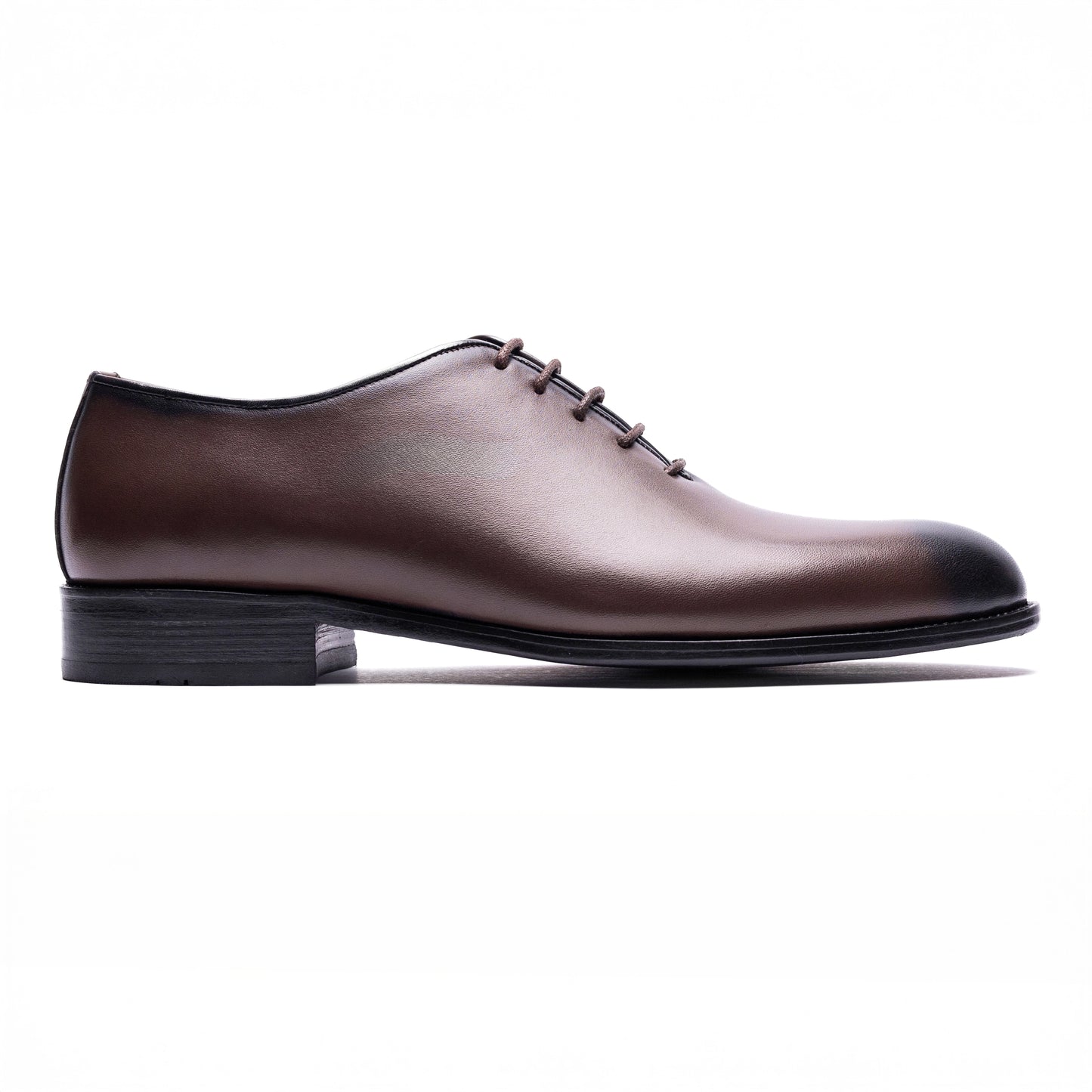 Side view of Valencia Wholecut Brown showing sleek tapered profile