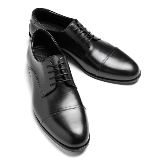 Front-facing image of the Cap Toe Derby Black, crafted from premium leather with timeless Derby structure