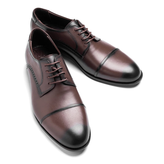 Frontal image of the Cap Toe Derby Brown revealing sleek lacing and formal structure